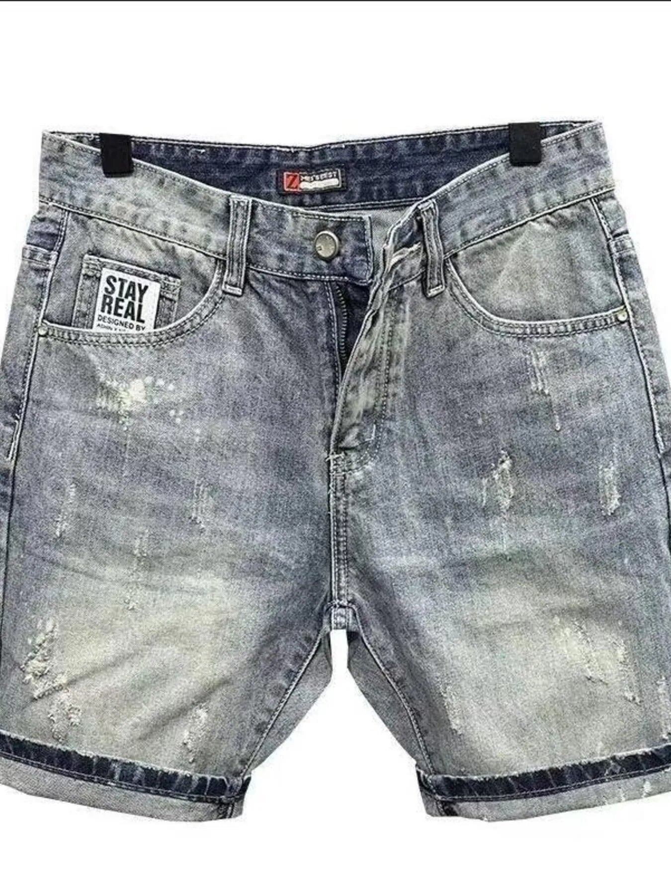 Light gray distressed denim shorts with front pockets and zipper fly