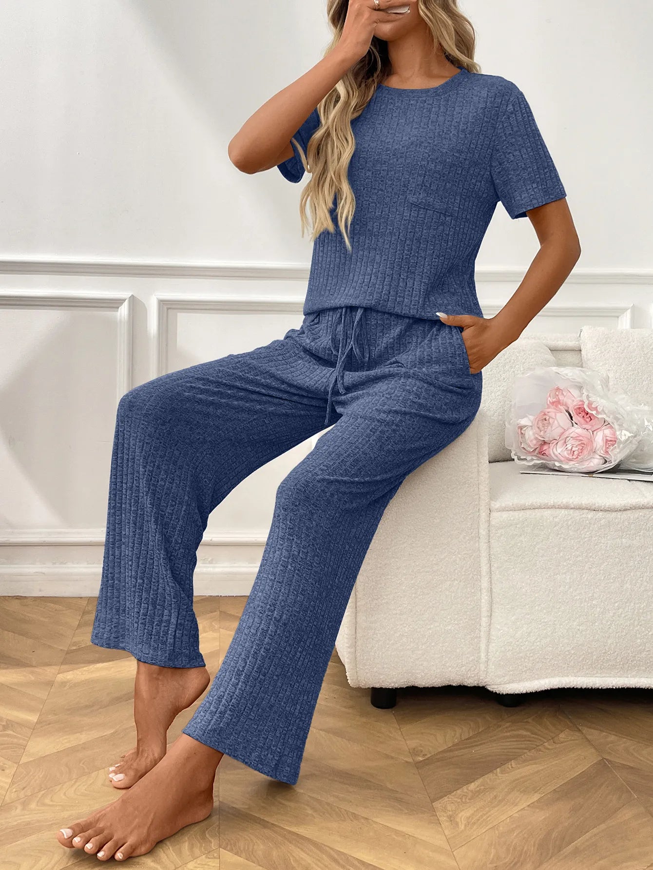 Ribbed knit lounge set in blue: wide-leg pants and short sleeve top with drawstring waist