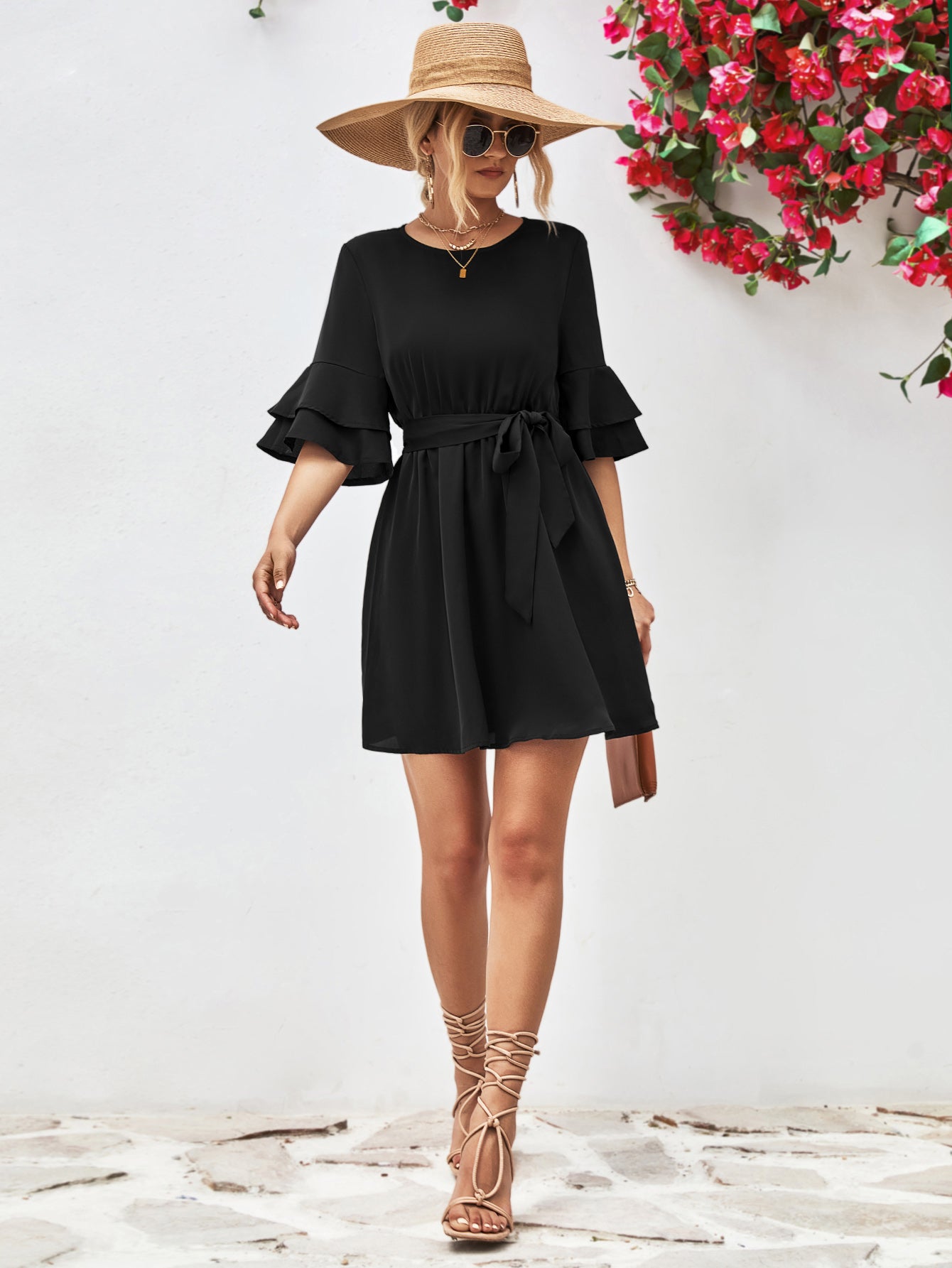 Black round-neck dress with tie belt and flounce sleeves, knee-length A-line