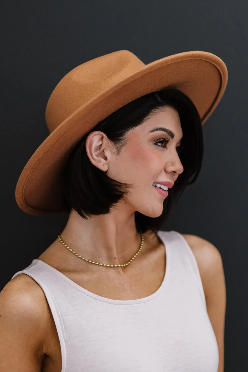 Khaki fedora hat with black trim band, medium crown