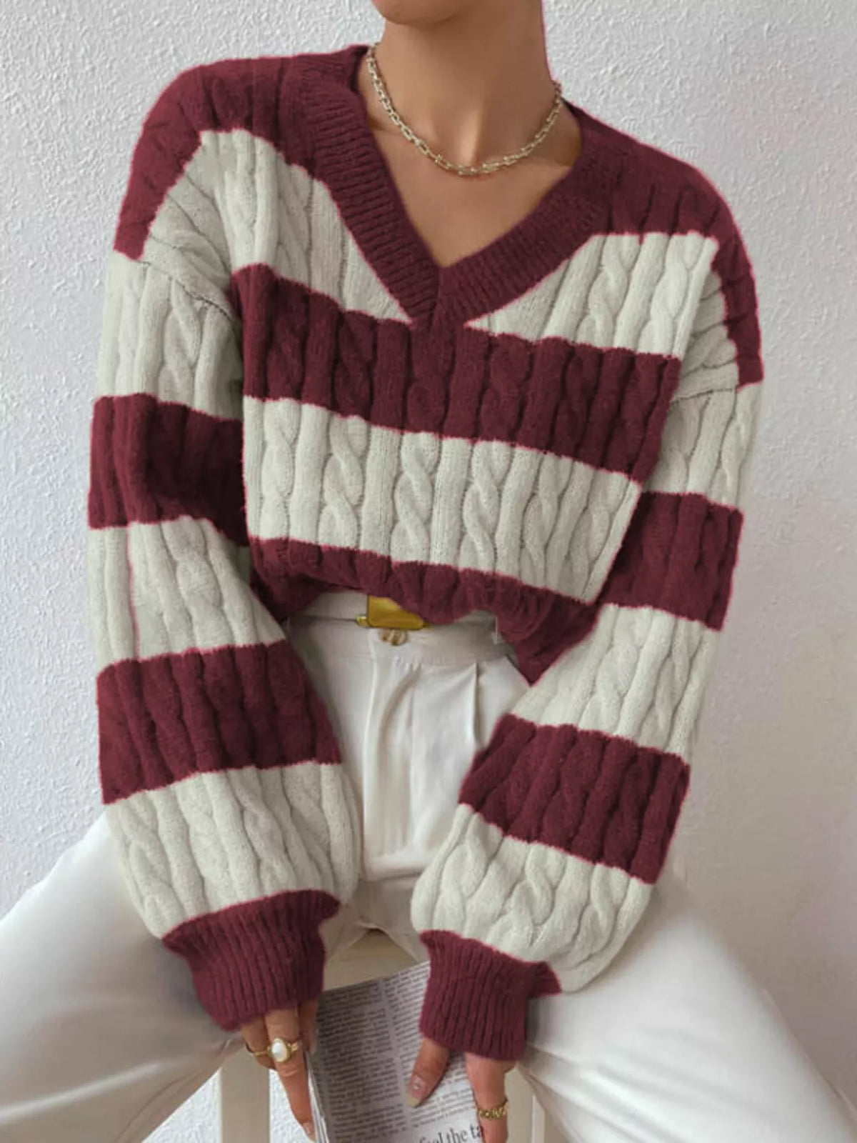 Wine red and off-white striped cable knit V-neck sweater with long ribbed sleeves