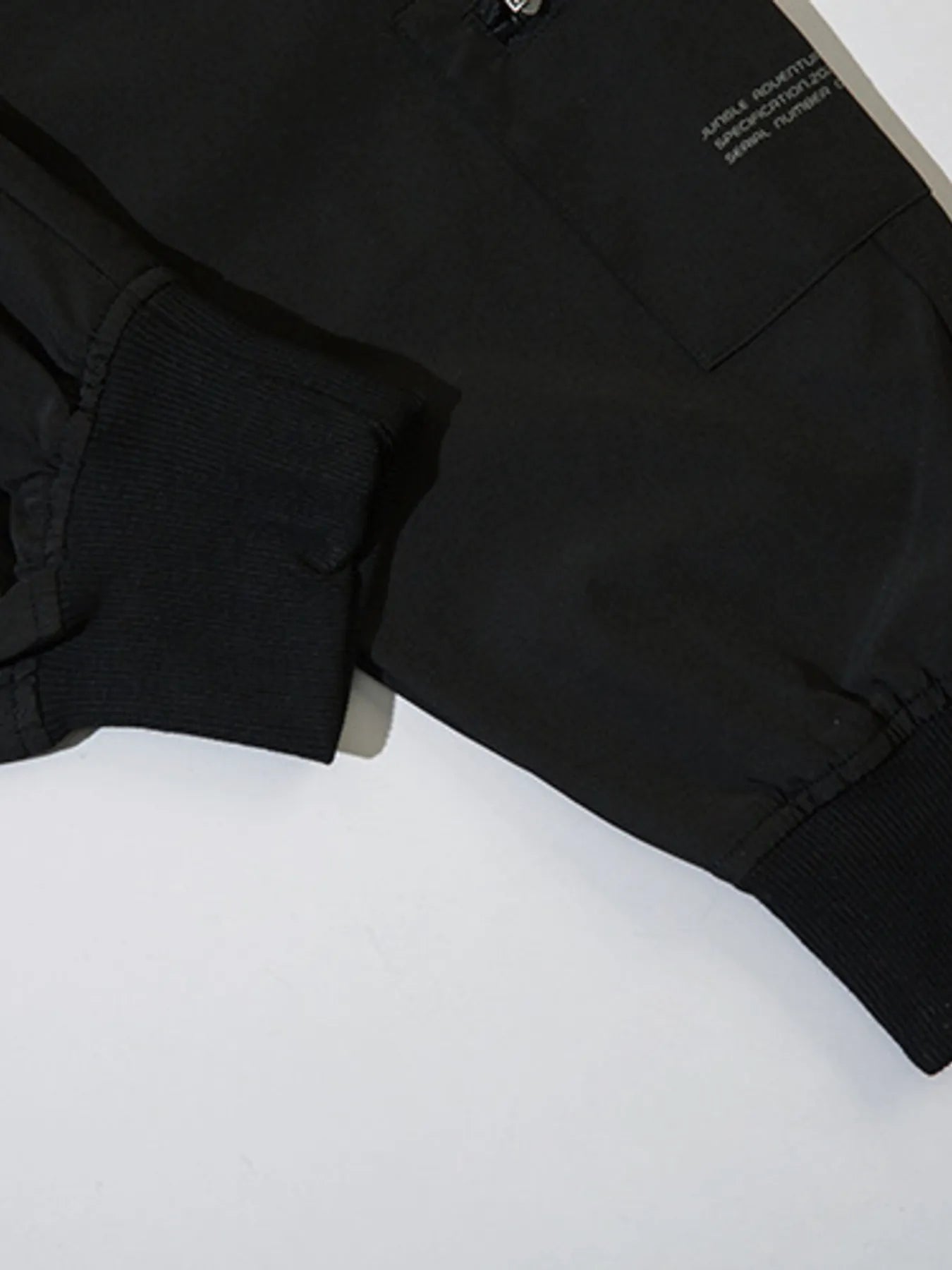 Black cargo joggers with elastic waistband and loose leg opening hem