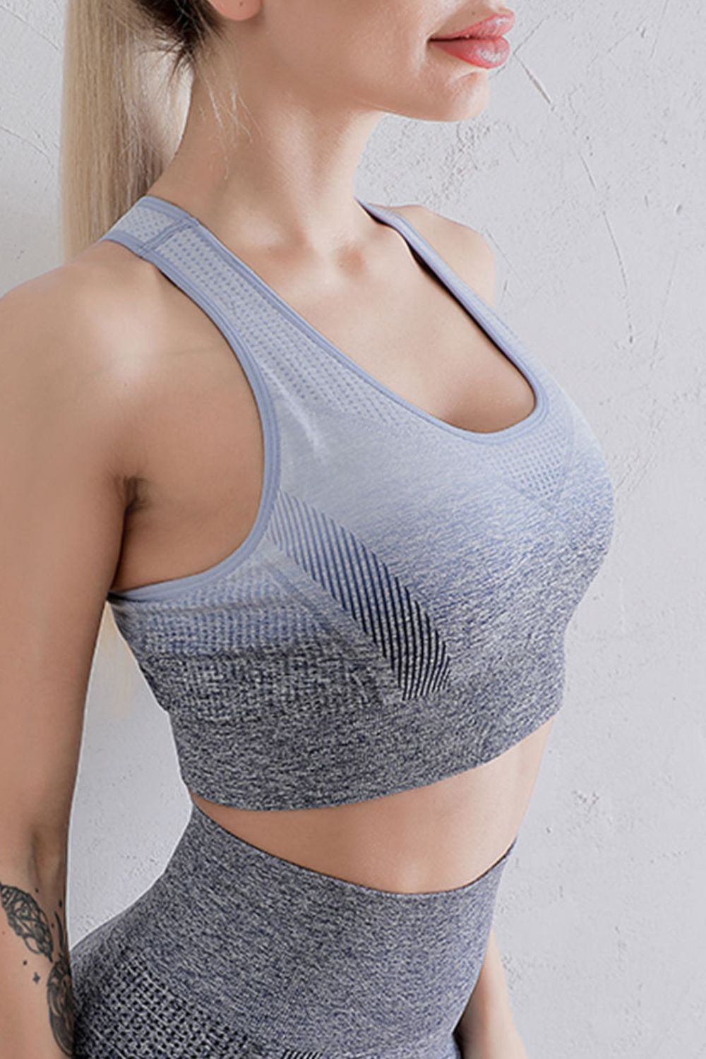 Light grey and blue gradient racerback sports bra with scoop front and breathable knit