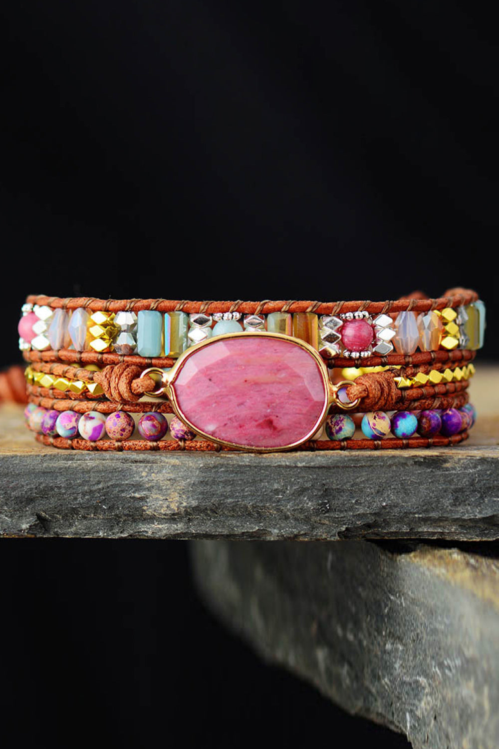 Beaded wrap bracelet with oval pink cabochon center and multicolor bead rows