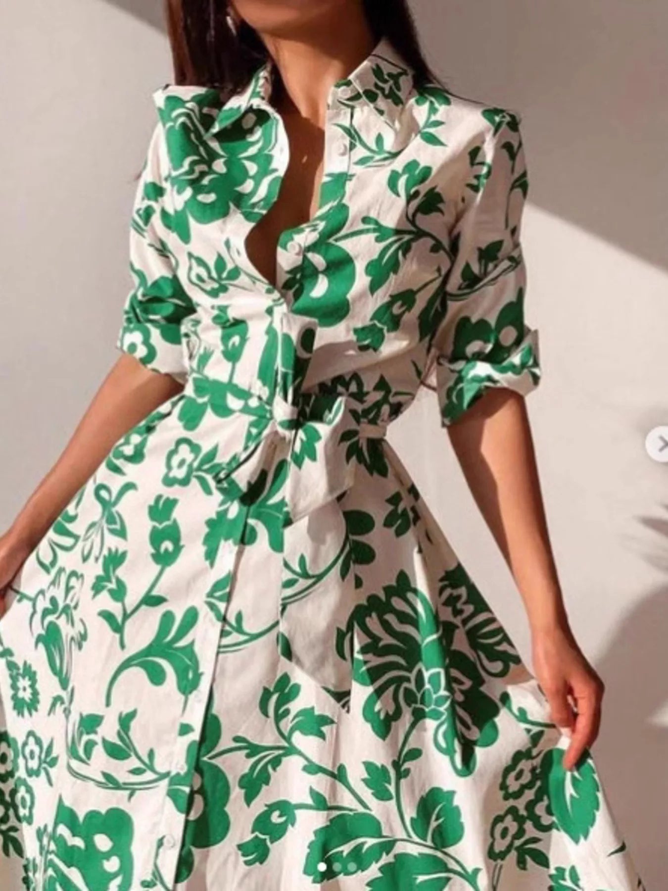 Green and white floral belted V-neck midi dress with 3/4 sleeves, front view