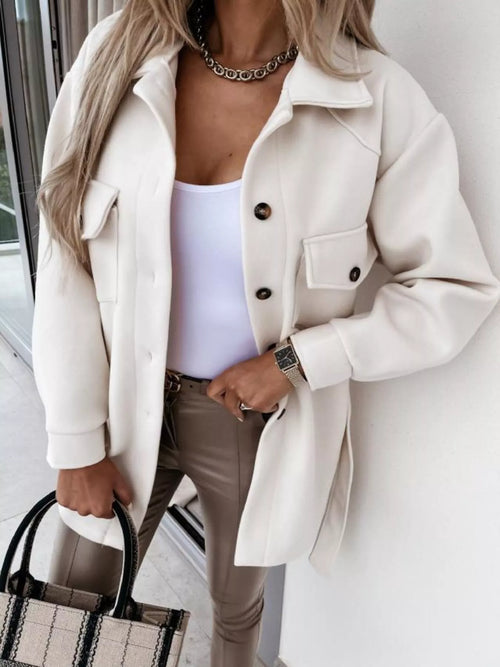 White button-down tie-waist coat with flap chest pockets and dark buttons
