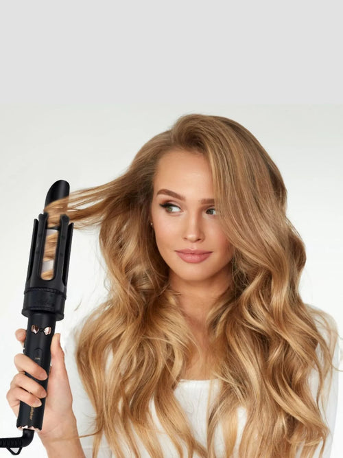 Black automatic rotating curling iron with dual ceramic barrel and handle grip