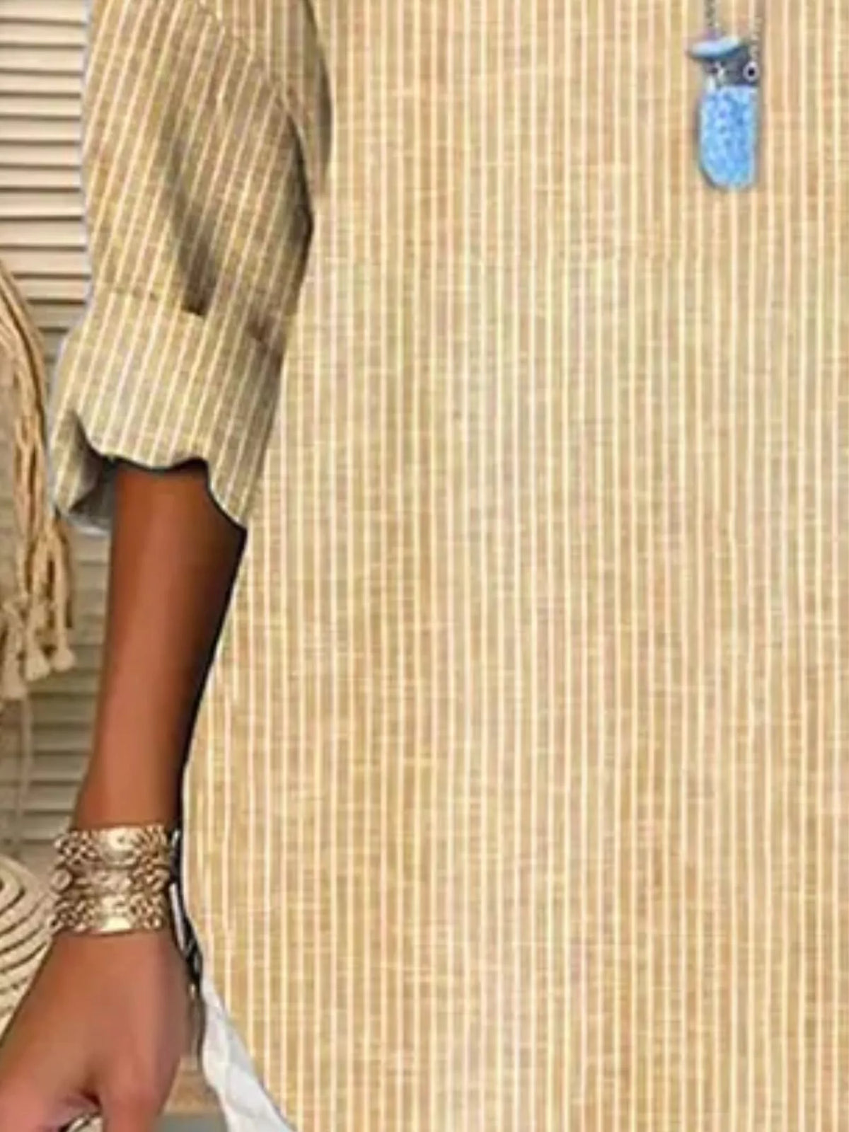 Women's striped long-sleeve blouse in light yellow with cuffed sleeves