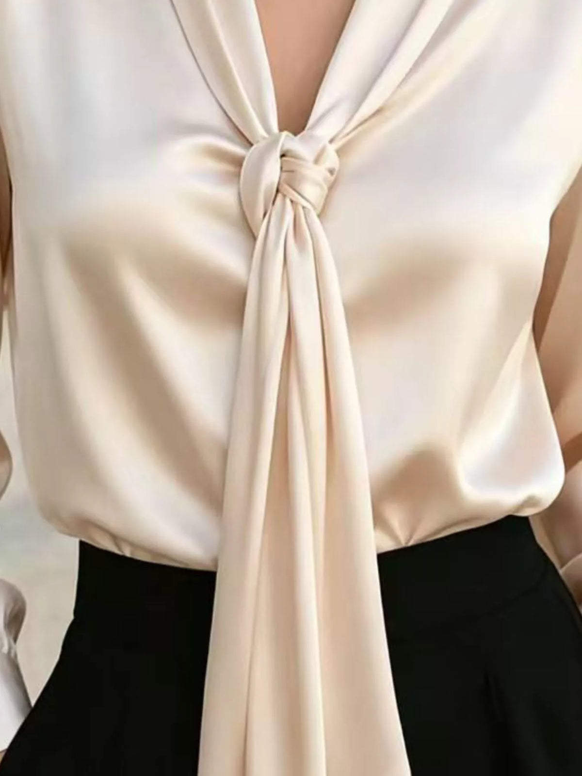 Ivory satin blouse front with gathered V-neck and long tie knot