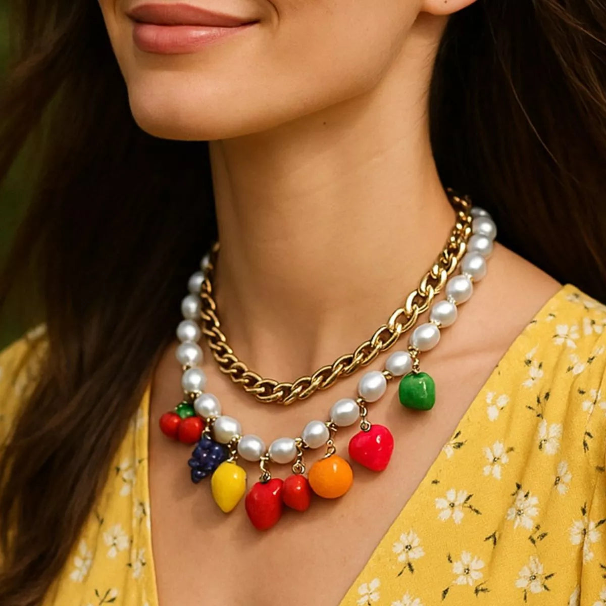 Double-layer charm necklace with gold chain, white pearls, and colorful fruit beads
