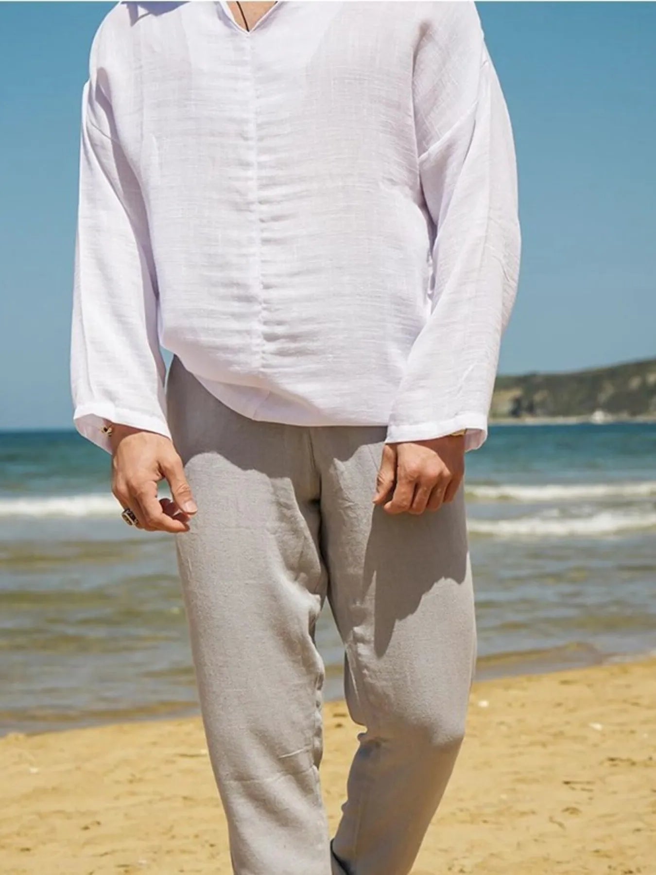 White V-neck long sleeve top with textured fabric and straight hem