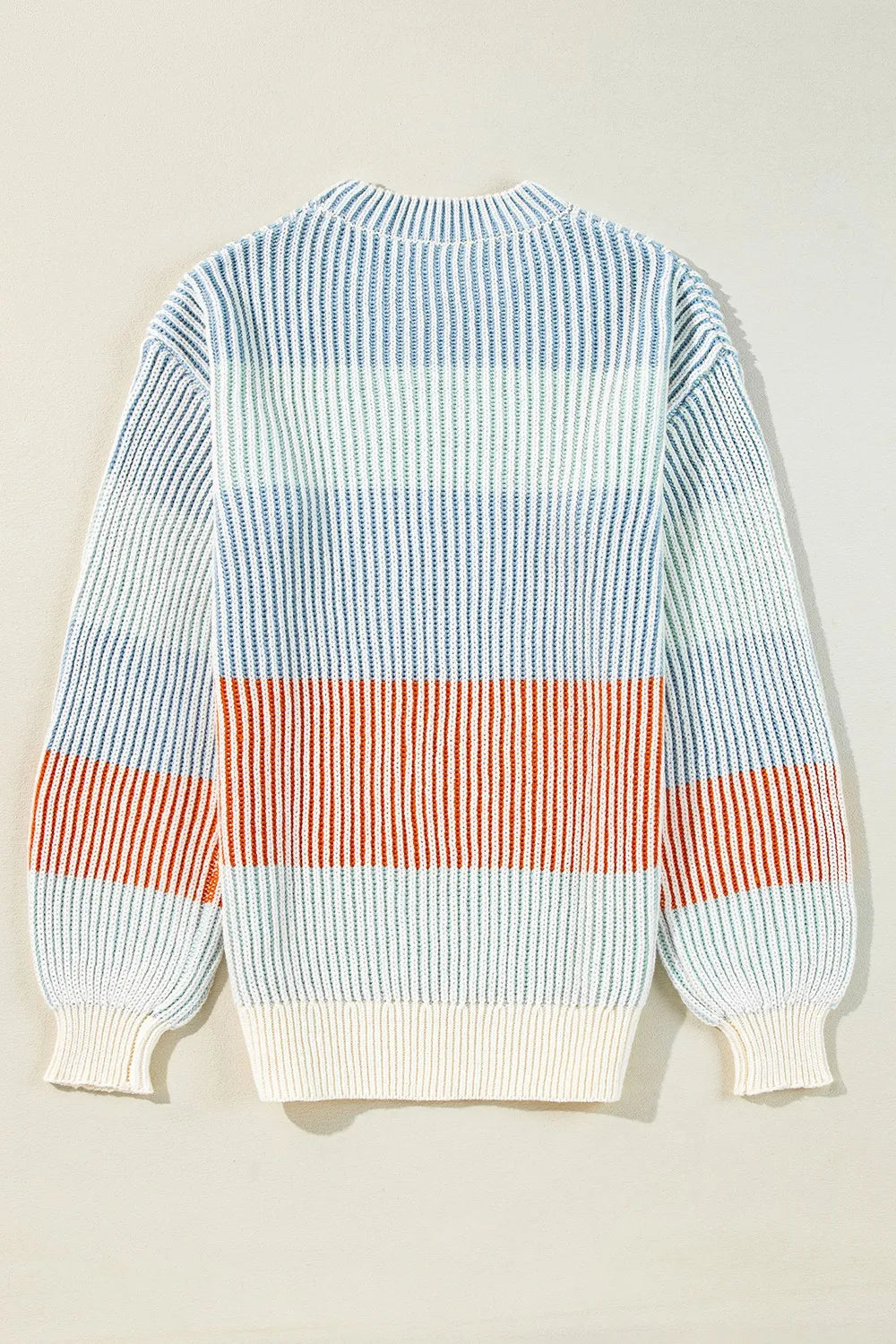 Back view color-block striped long-sleeve sweater in light blue, cream, and orange