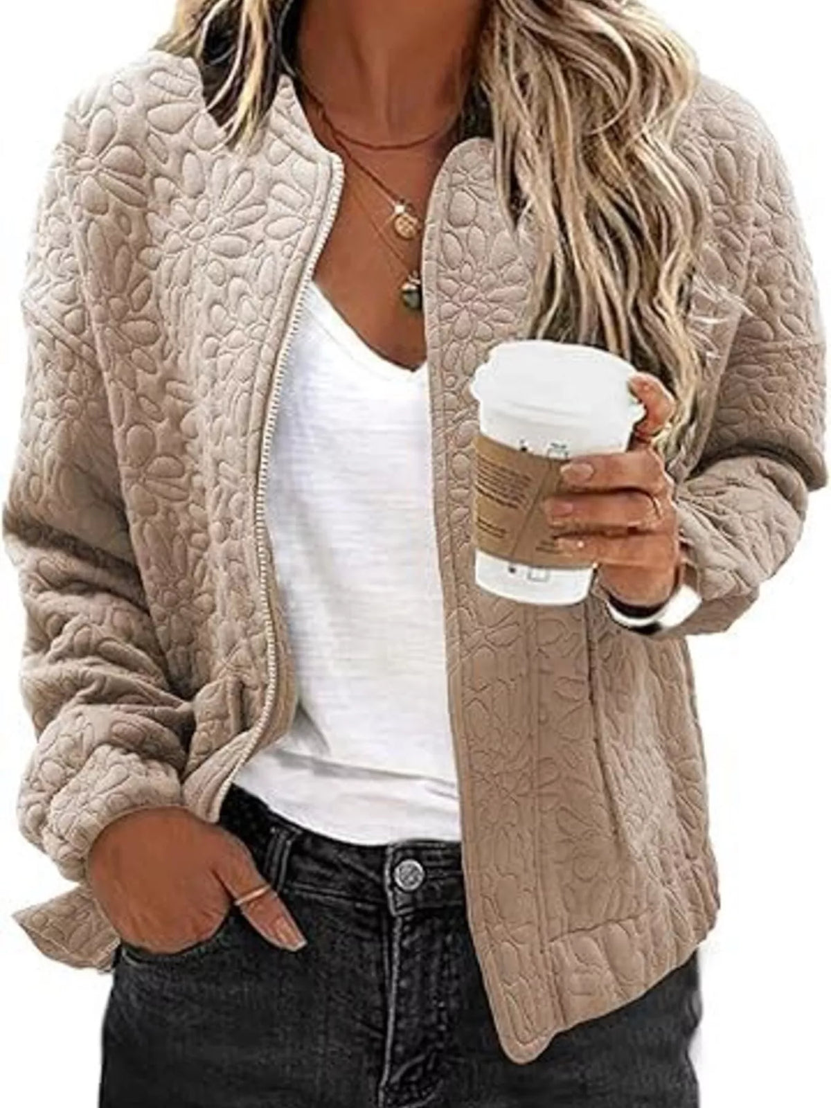Quilted zip-front jacket in light beige with embossed floral texture