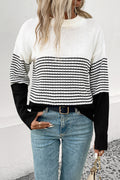 Striped drop-shoulder sweater in white with black horizontal bands, ribbed cuffs and hem