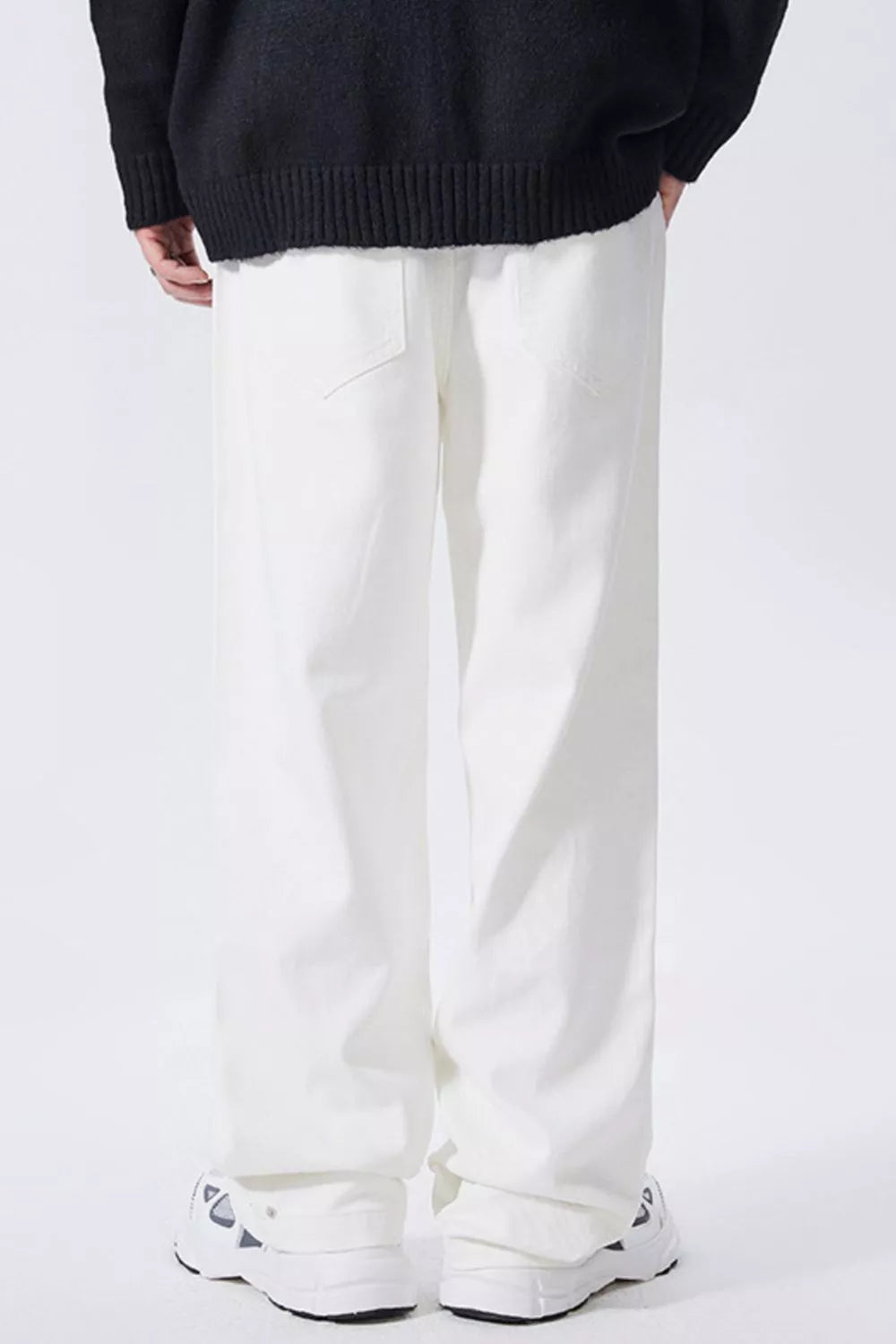 White relaxed-fit wide-leg cotton jeans with front pockets, straight wide leg opening