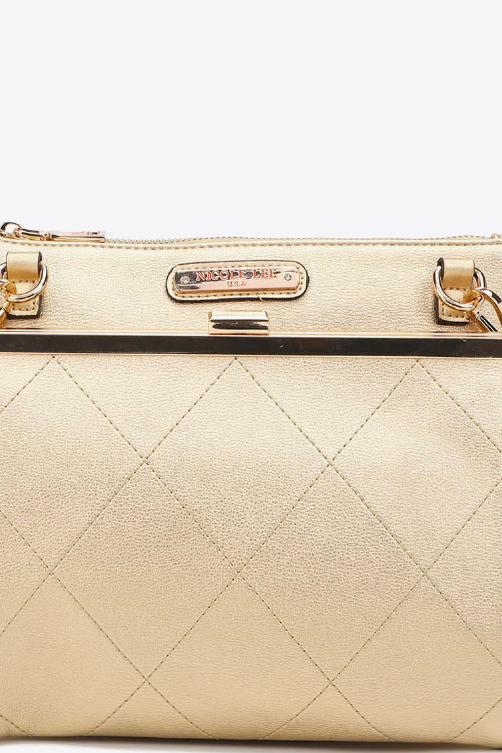 Beige quilted handbag top with Nicole Lee USA label and metal clasp bar