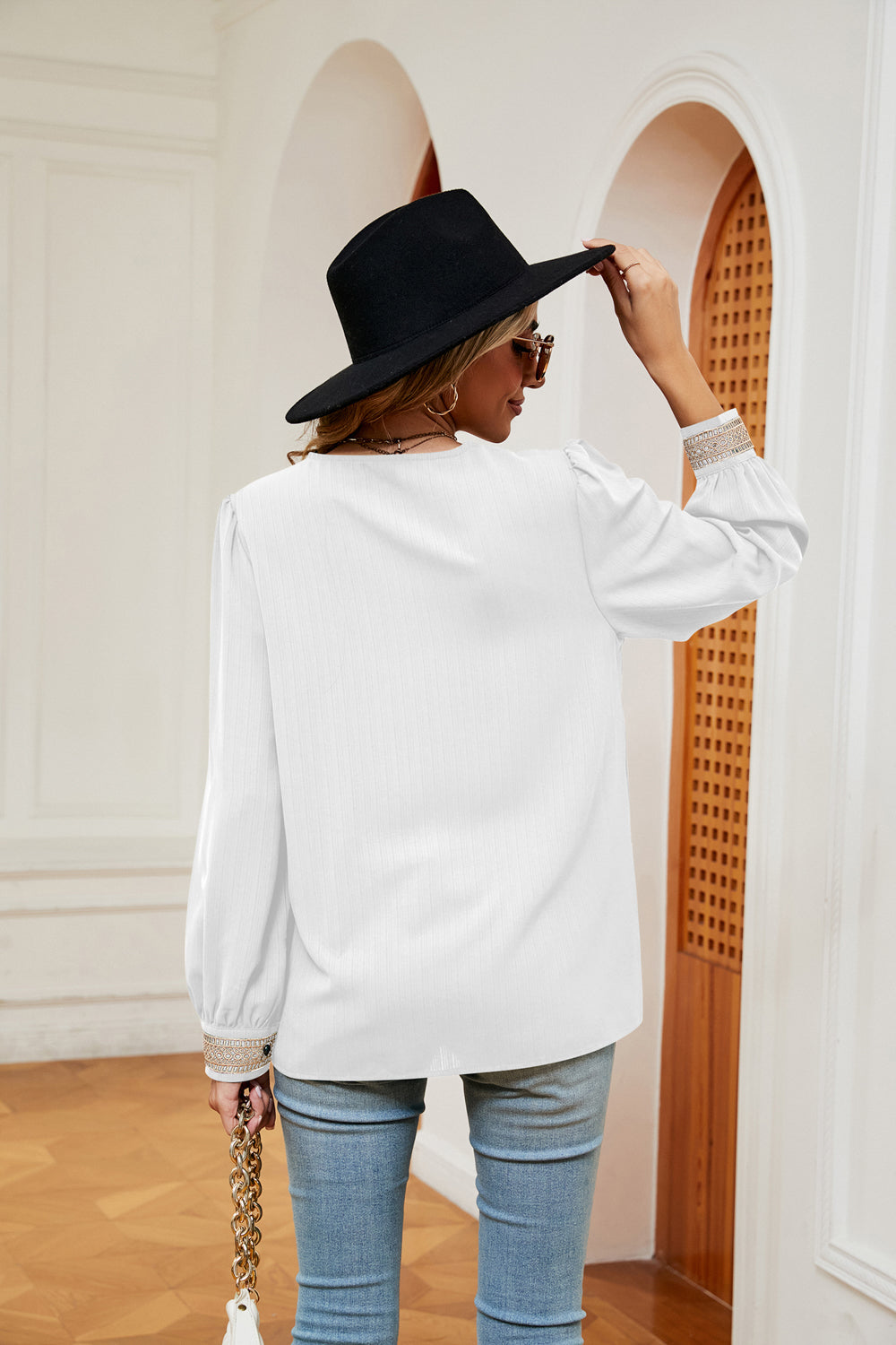 White contrast V-neck puff sleeve blouse, back view