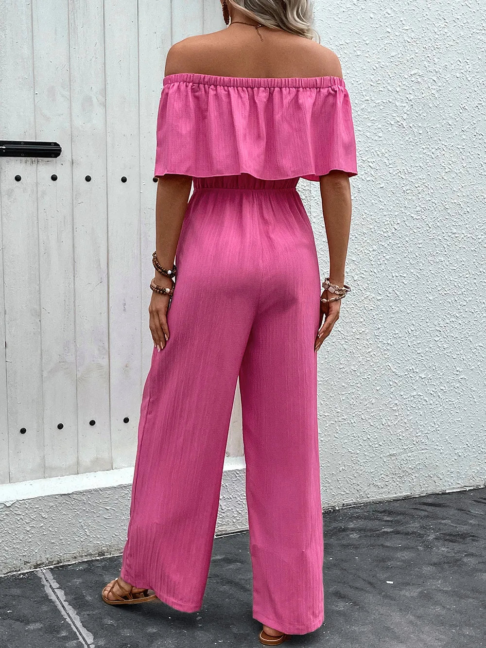 Hot pink off-shoulder wide-leg jumpsuit, back view, elastic neckline and waist