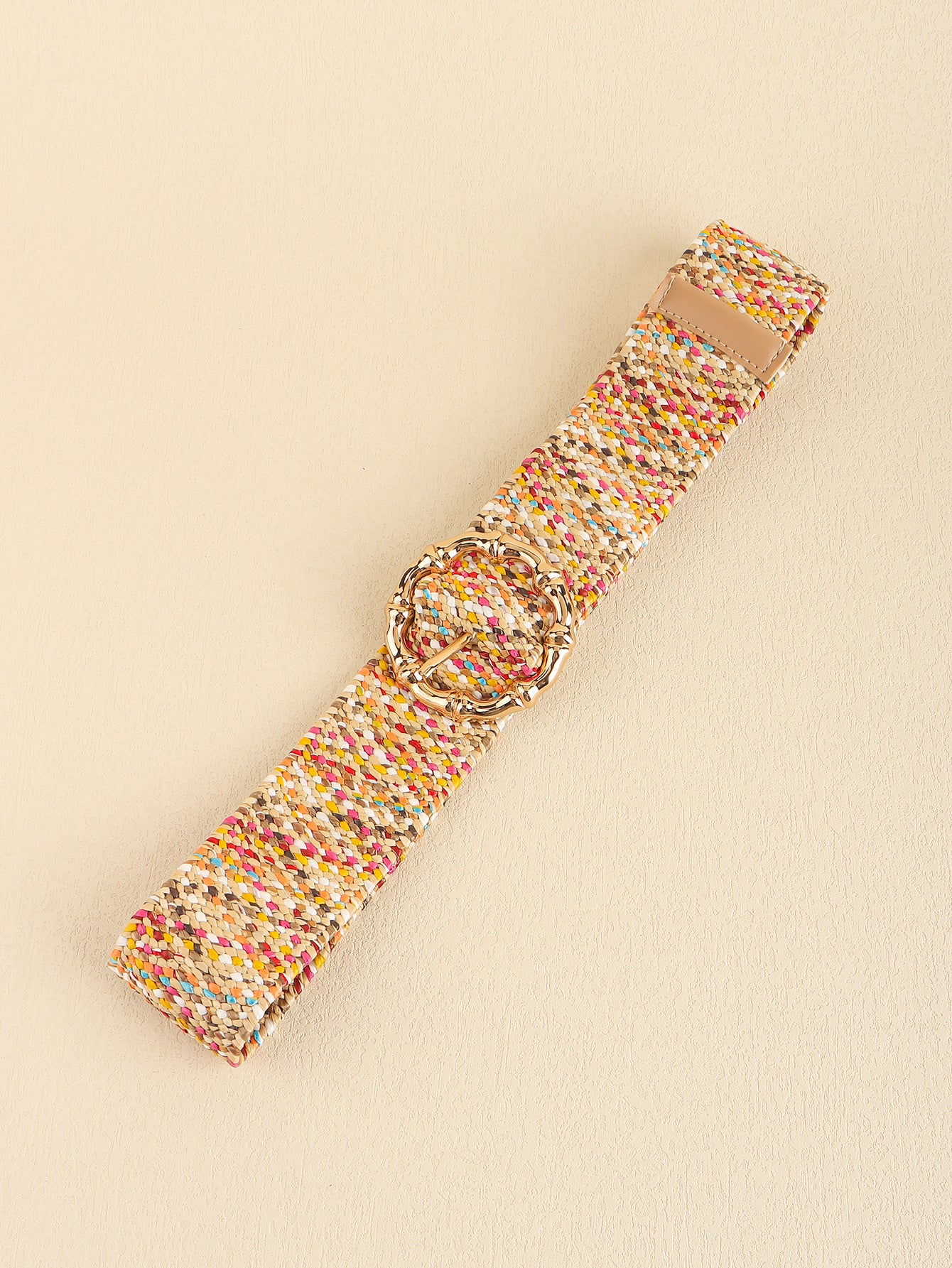 Multicolored wide belt belt and buckle detail with tan leather end and strap keeper