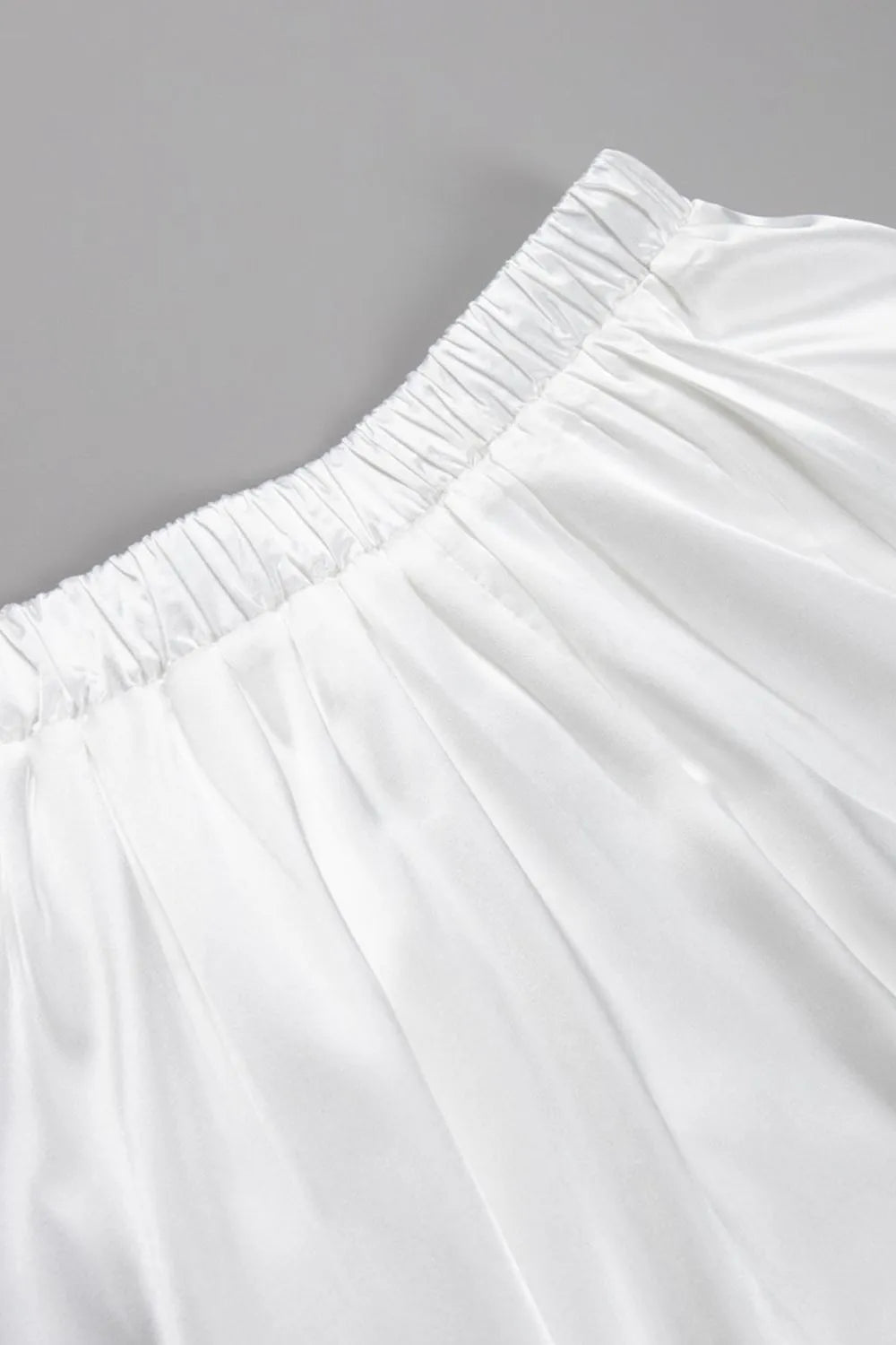 White satin midi skirt waistband with elastic gathers, soft pleated drape