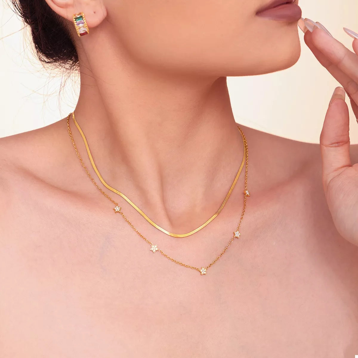 Gold-plated double necklace with curved bar chain and star zircon drop charms