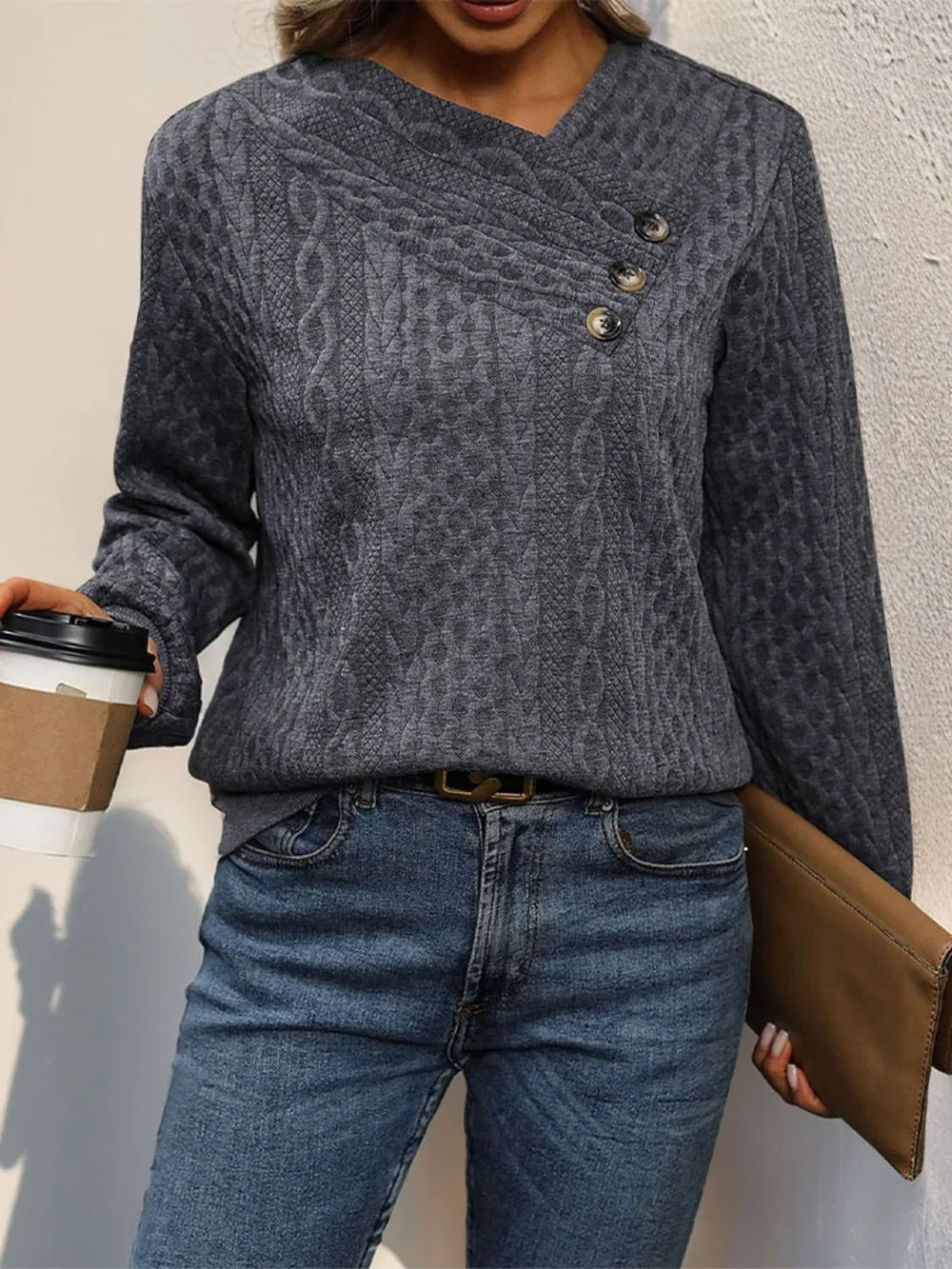 Dark gray long sleeve sweatshirt with textured cable pattern and buttoned neckline