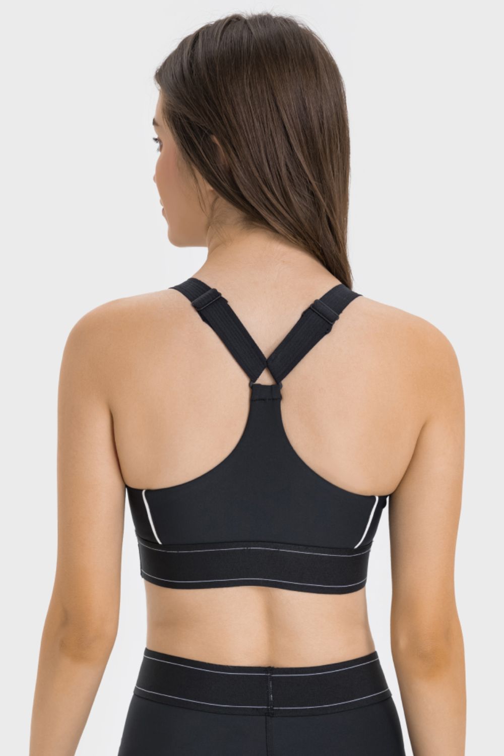 Black contrast sports bra back view with crisscross strap detail and trim