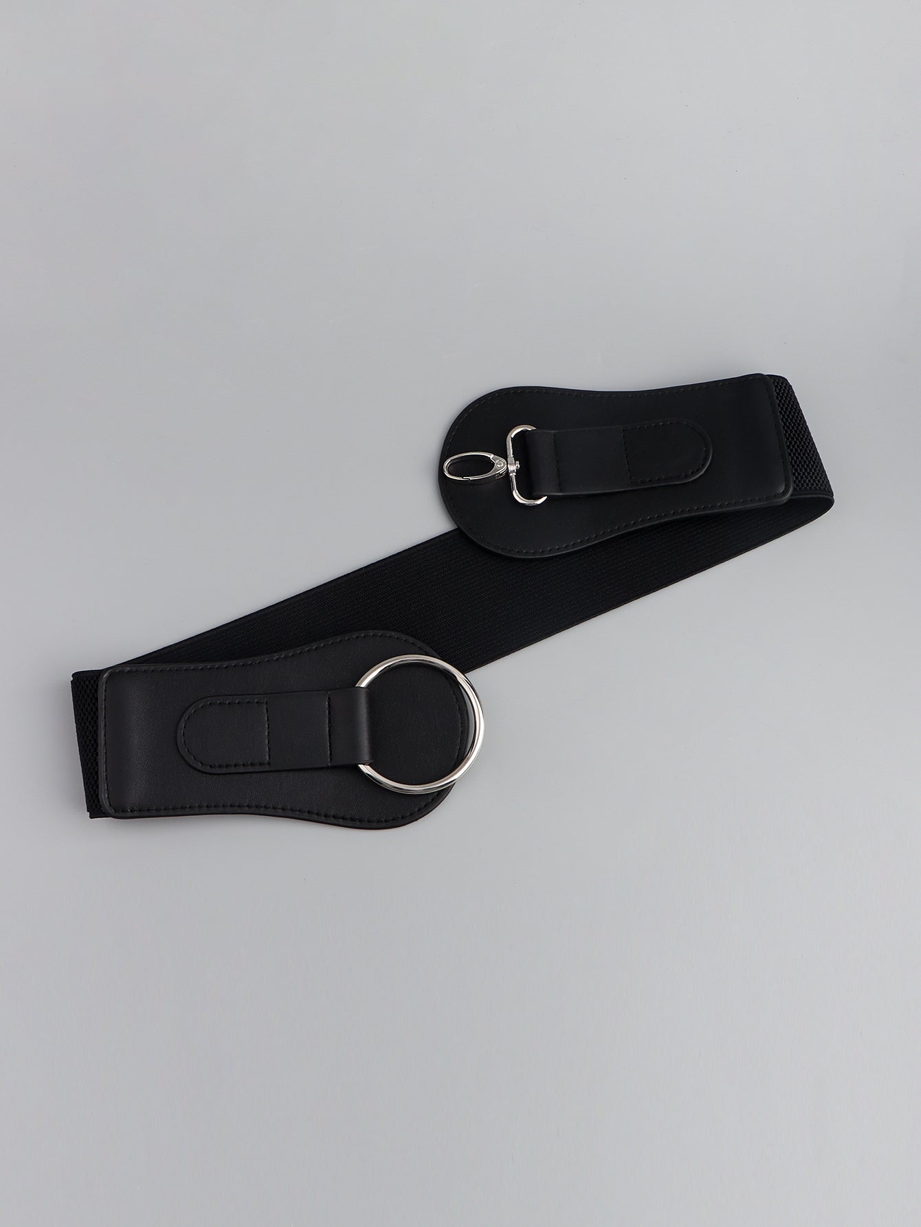 Black wide elastic belt with silver O-ring and adjustable buckle on strap end