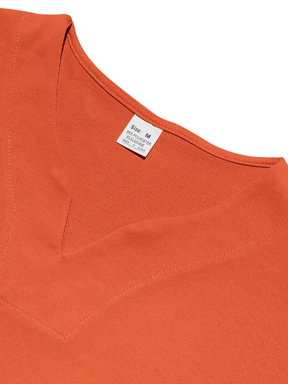 Orange V-neck tee close-up with size label on collar neckline and soft stretch fabric.