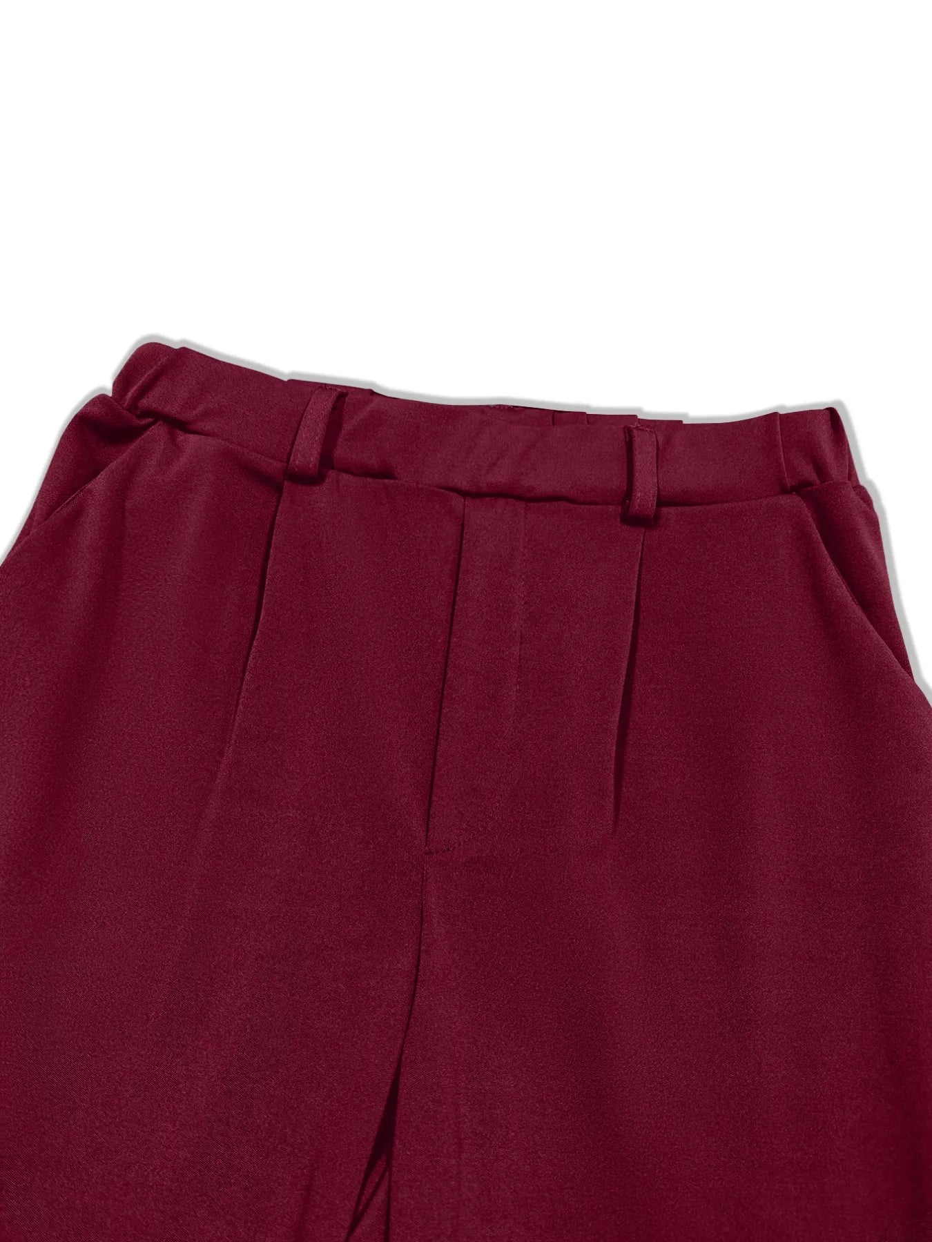 Burgundy pleated detail pants waistband close-up with belt loops and elastic back