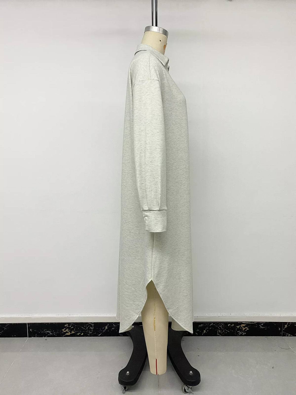 Light gray polo-collar midi dress with long sleeves and side vent detail