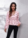 Blush pink butterfly print V-neck peplum blouse with balloon sleeves