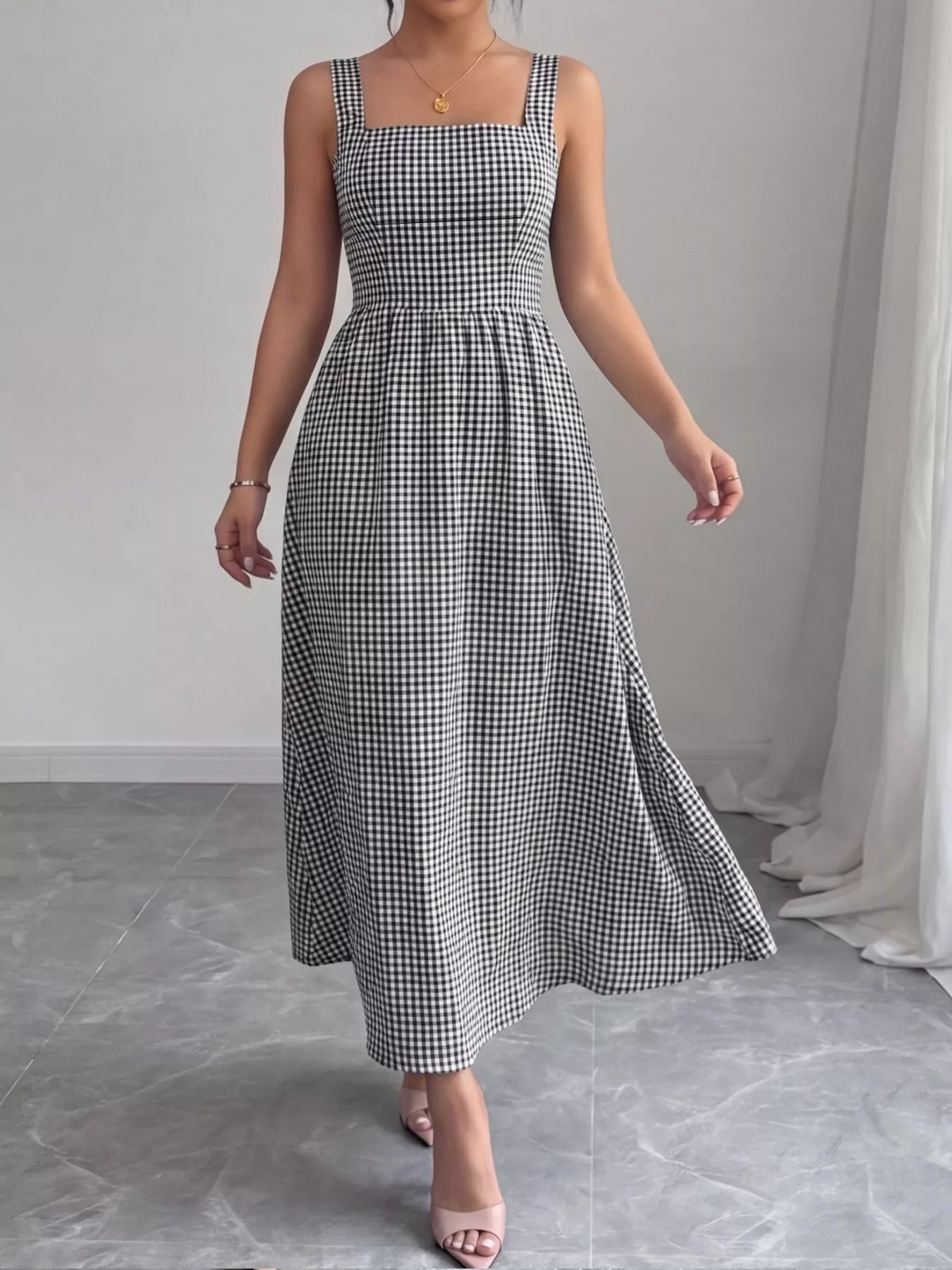 Black-and-white gingham square-neck sleeveless midi dress with gathered waist and side flare