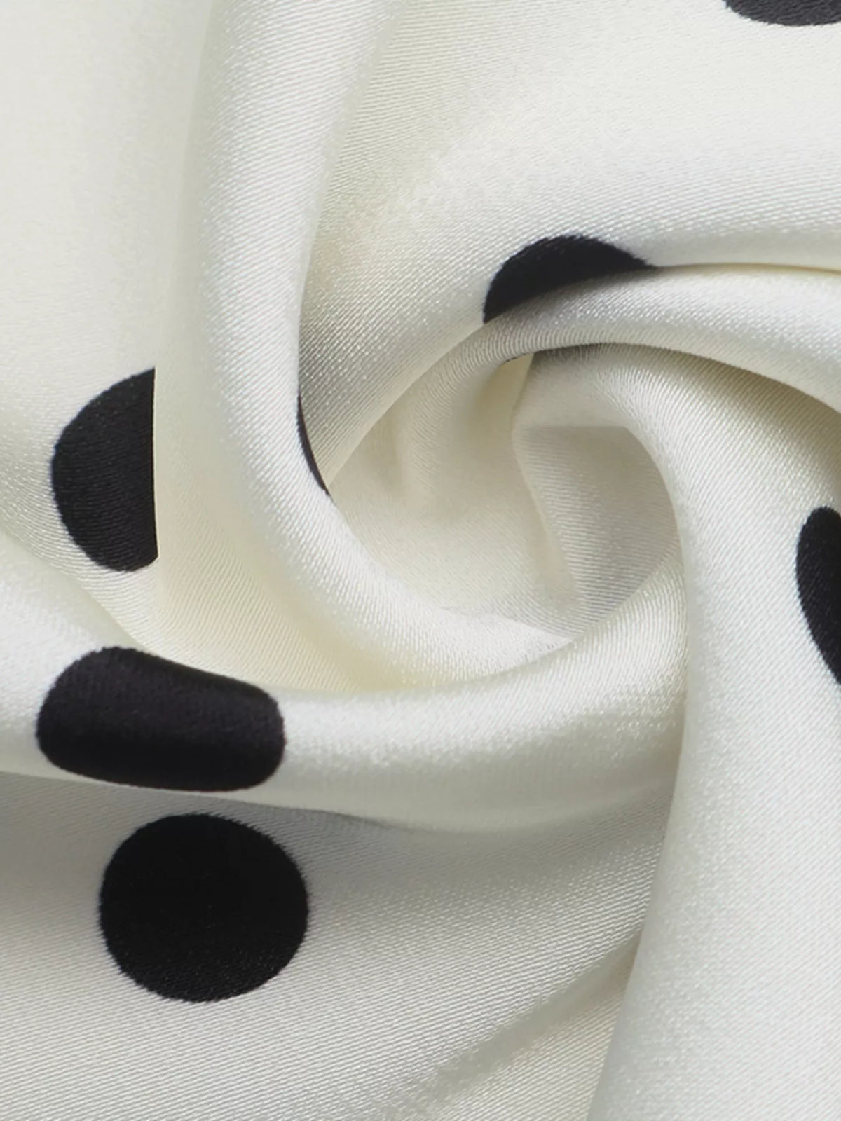 Off-white skirt fabric with black polka dots, gathered fold detail