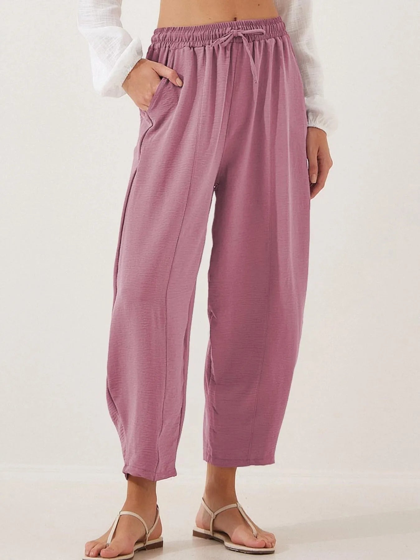 Mauve drawstring wide-leg cropped pants with elastic waistband, soft drape