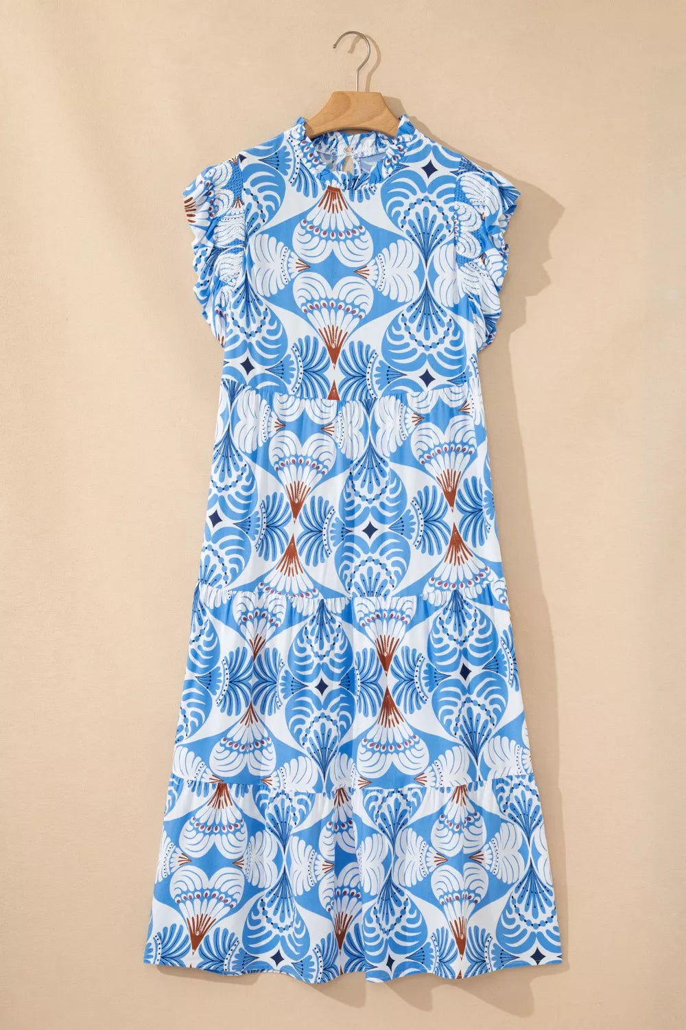 Cedar & Moore Tropical botanical print flutter sleeve vacation dress in blue and white with ruffle accents