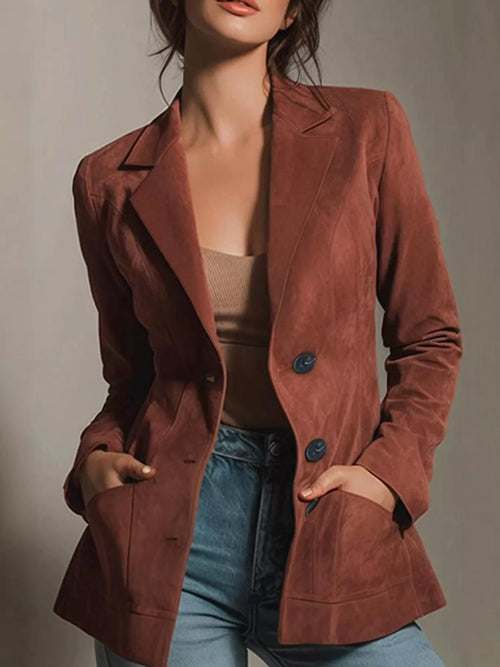 Rust-brown blazer with lapel collar, two-button front, and side pockets