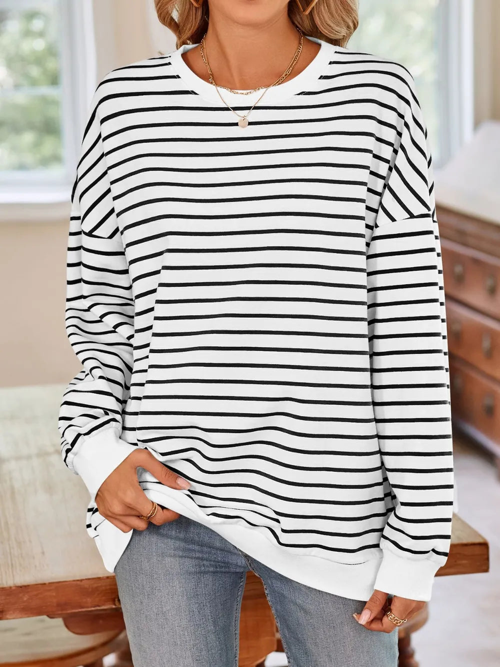 White base sweatshirt with black striped pattern, crew round neck and long sleeves
