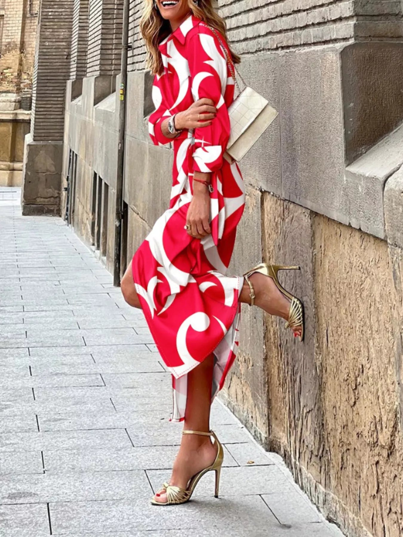 Red wrap midi dress with white abstract print and tied waist belt, midi length