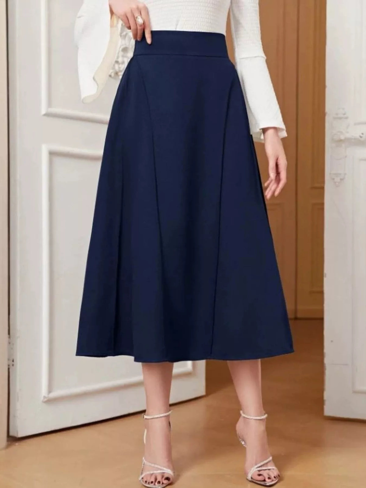 Dark blue A-line midi skirt, mid-calf length