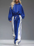 Blue hoodie with white drawstrings and wide-leg track pants with side stripes set