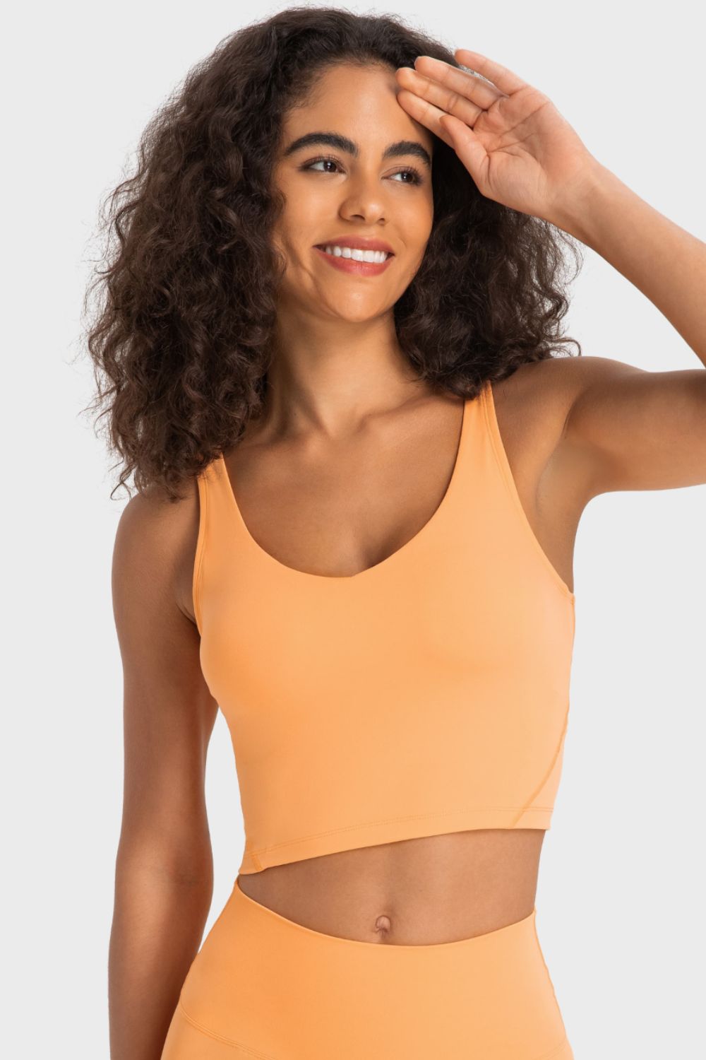 Orange crop sports bra with deep V-neck and smooth racerback fit