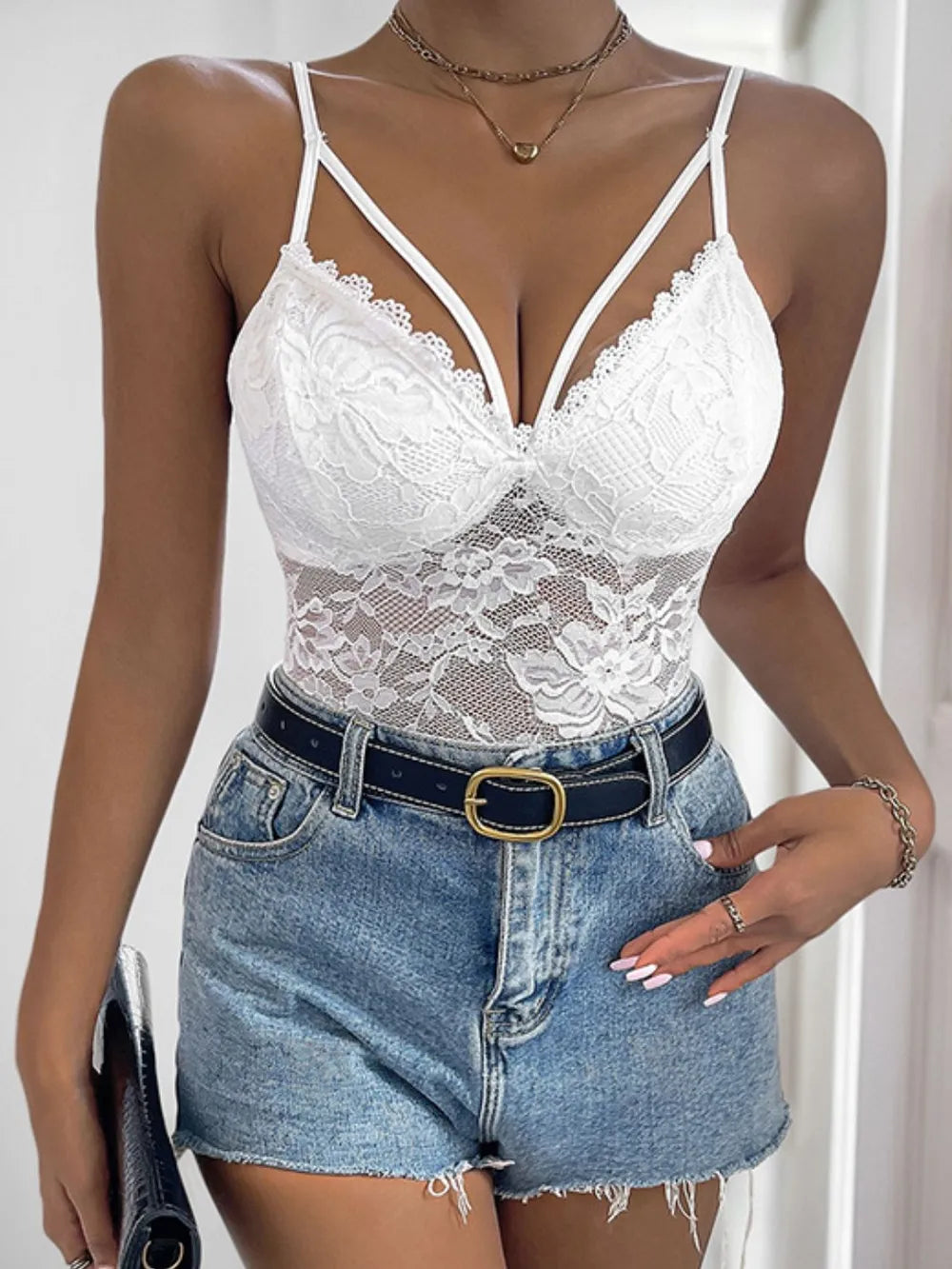 White lace spaghetti strap bodysuit with deep V-neck and floral lace front