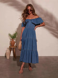 Dark blue off-shoulder tiered denim dress with ruffled neckline and tiered skirt