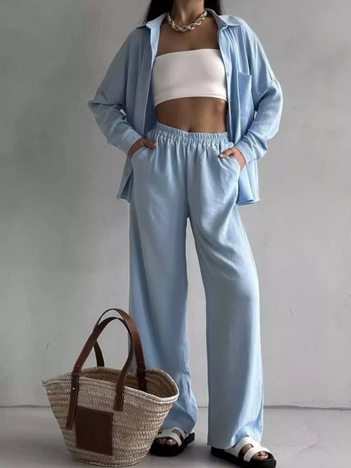Light blue button-down shirt and loose pants, front buttons and elastic waistband