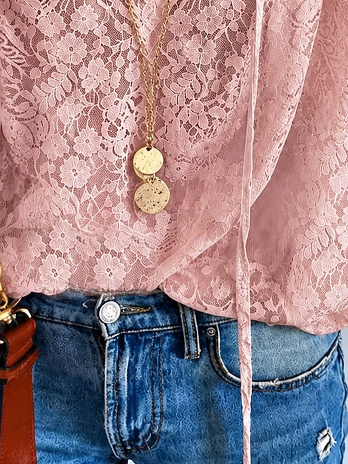 Pink openwork lace blouse with V-neck and loose sleeves, front detail view