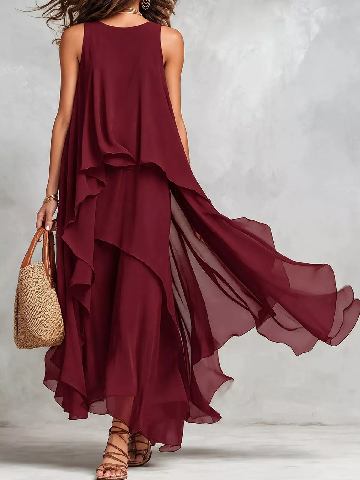 Burgundy sleeveless maxi dress, side view, with flowing tiered ruffle skirt