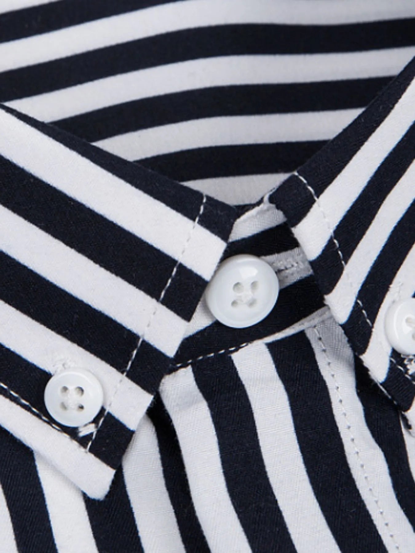 Striped button-up shirt collar detail, black and white stripes with round white buttons