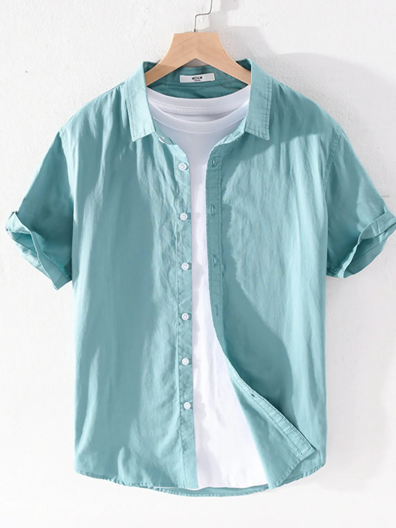 Men's short sleeve button-up shirt, teal green with front buttons and pointed collar