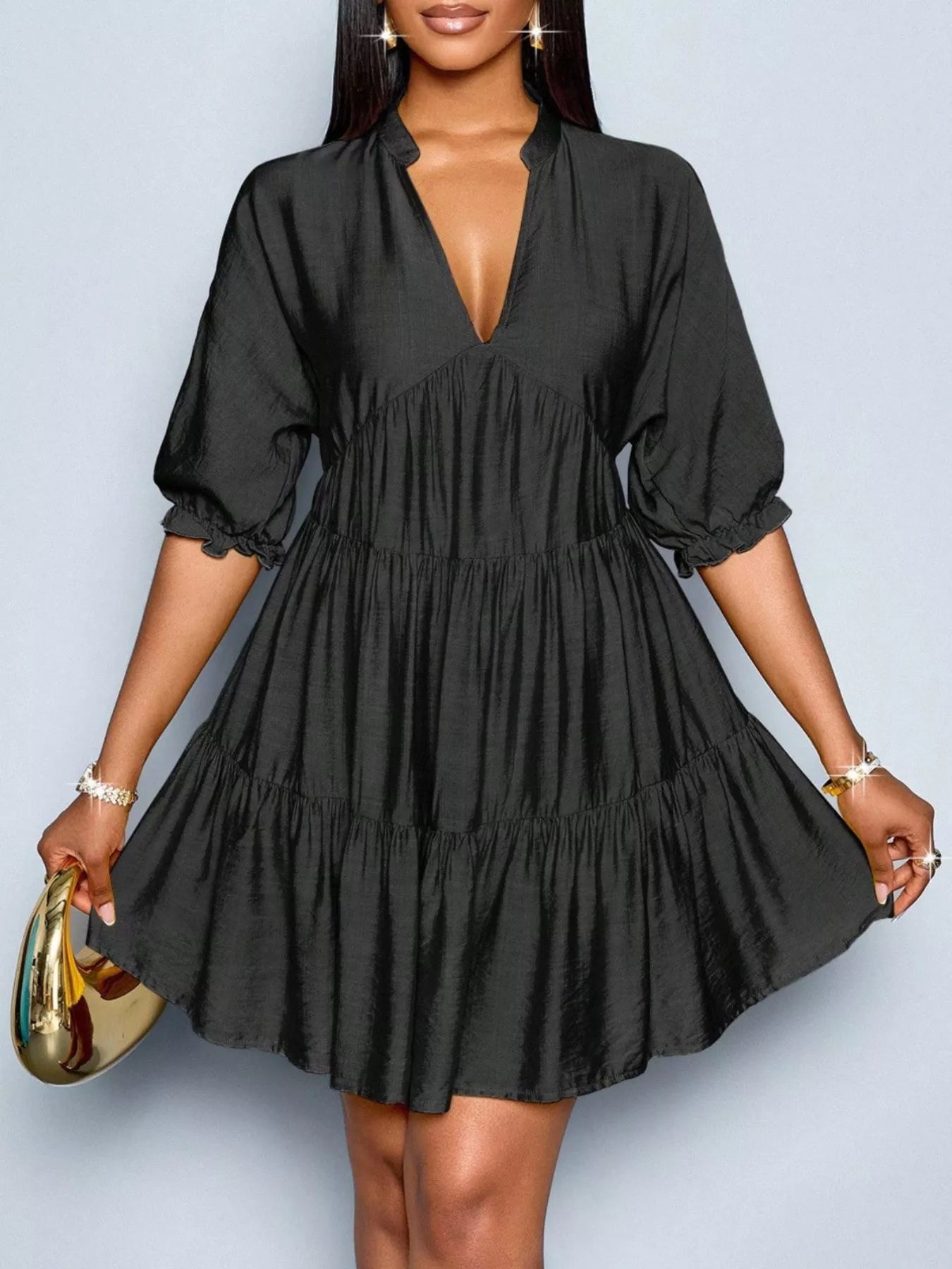 Black notched tiered dress with short puff sleeves and gathered waist tiers
